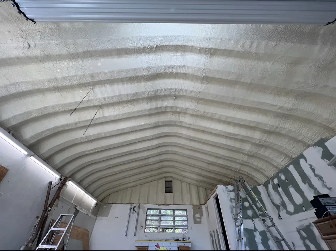 Spray polyurethane foam applied to the underside of a metal roof deck in Breitung